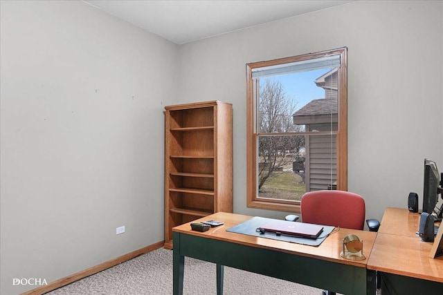 carpeted home office with a healthy amount of sunlight