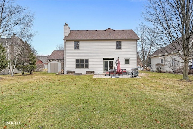 rear view of house featuring a shed, a yard, and a patio area