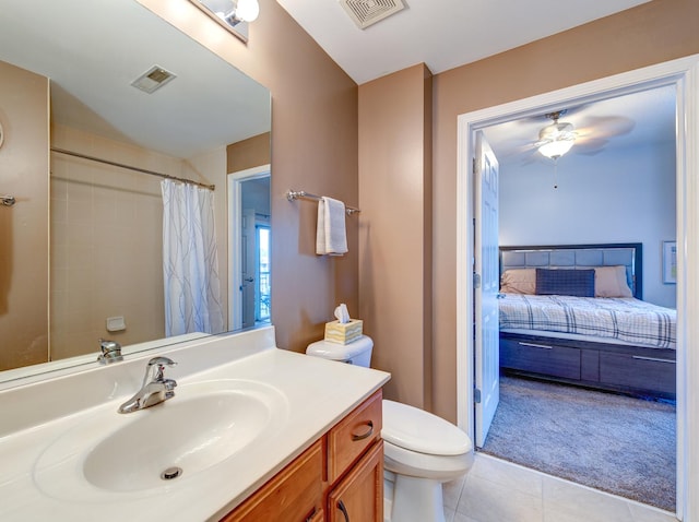 ensuite bathroom featuring toilet, vanity, visible vents, and tile patterned floors