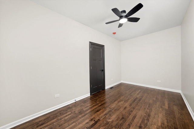 unfurnished room featuring dark hardwood / wood-style floors and ceiling fan