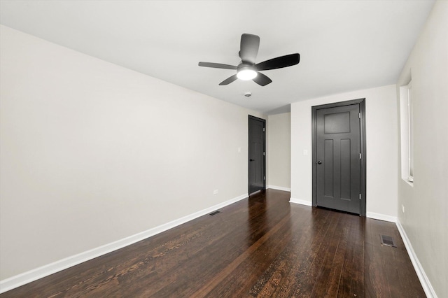 unfurnished bedroom with dark wood-type flooring and ceiling fan