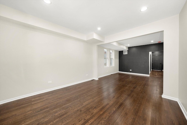 unfurnished living room with dark hardwood / wood-style floors