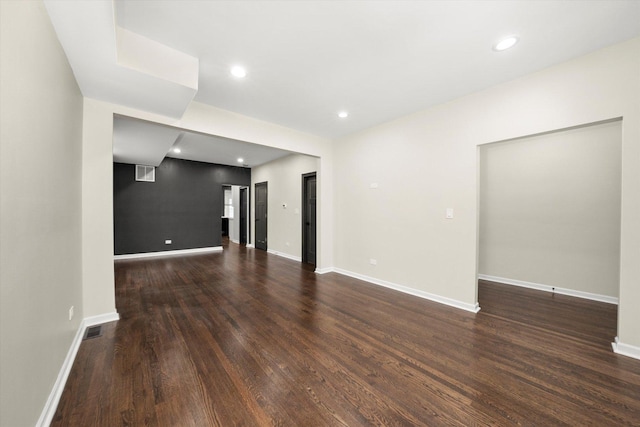 spare room with dark hardwood / wood-style floors