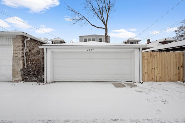 view of snow covered garage