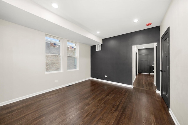 unfurnished room featuring dark hardwood / wood-style floors