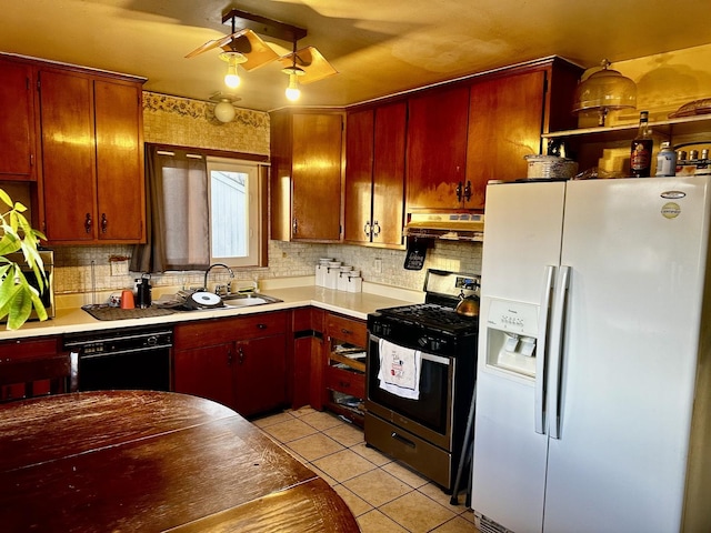 kitchen with light tile patterned flooring, sink, stainless steel range with gas cooktop, dishwasher, and white refrigerator with ice dispenser