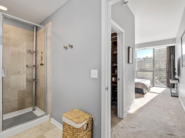 bathroom with a shower with shower door