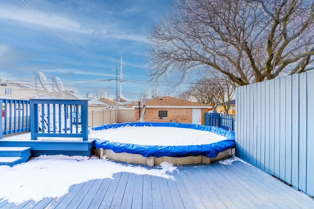 view of snow covered deck