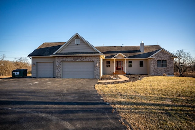 single story home with a garage and a front yard