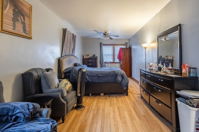 bedroom with ceiling fan and light hardwood / wood-style floors