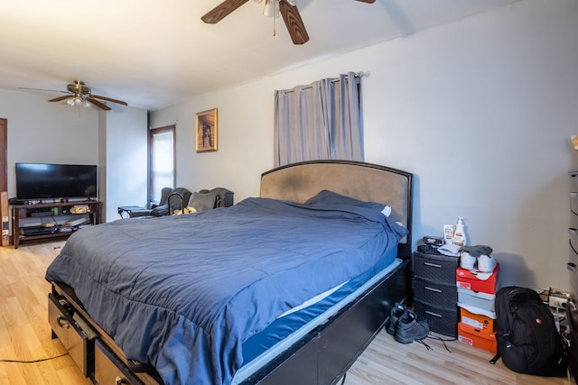 bedroom with hardwood / wood-style floors and ceiling fan