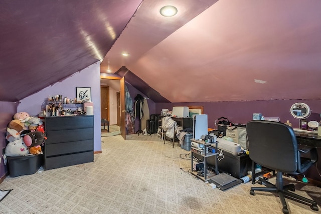 carpeted office space with vaulted ceiling