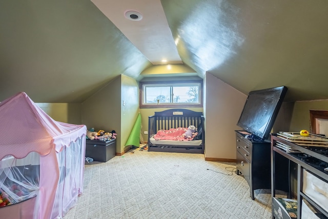 carpeted bedroom featuring vaulted ceiling