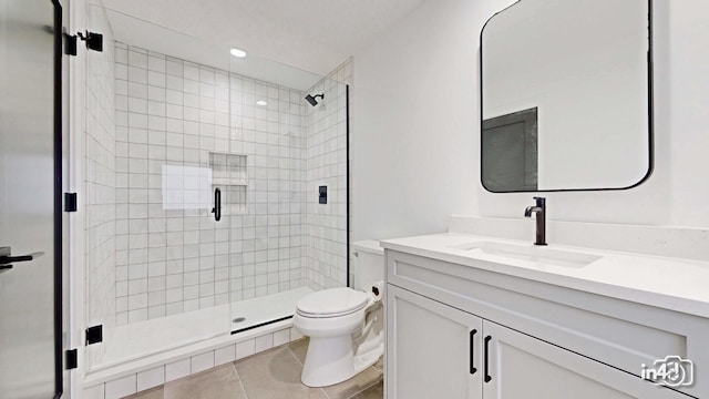 bathroom with vanity, an enclosed shower, tile patterned floors, and toilet