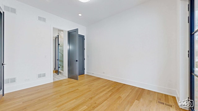 spare room featuring hardwood / wood-style floors