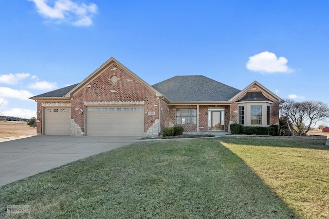 view of front of home featuring a garage and a front lawn