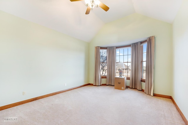 unfurnished room with vaulted ceiling, light carpet, and ceiling fan