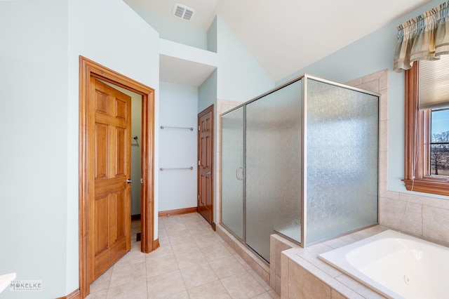 bathroom with lofted ceiling, plus walk in shower, and tile patterned flooring