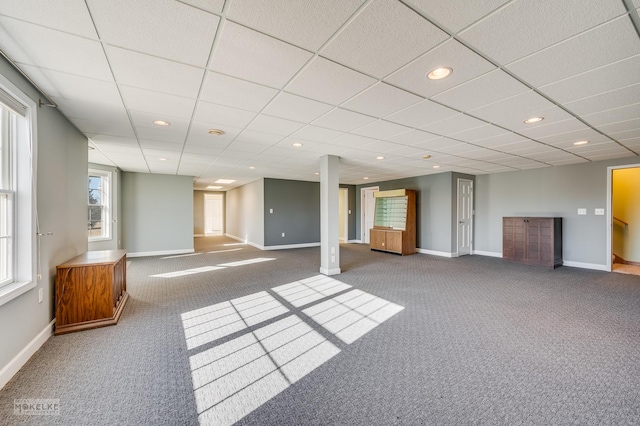 basement with carpet and a drop ceiling