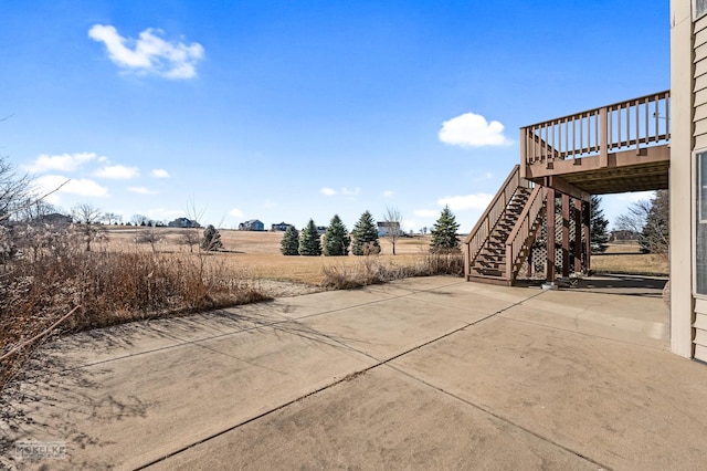 exterior space with a rural view and a wooden deck