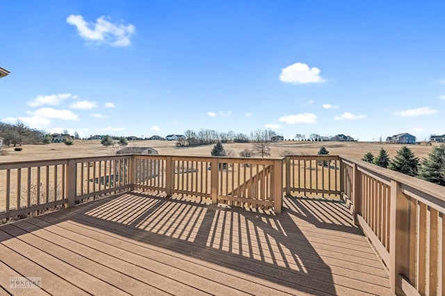 wooden terrace with a rural view