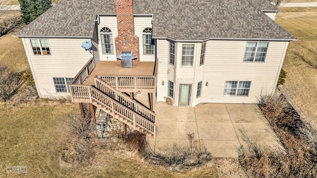 back of property with a patio and a deck