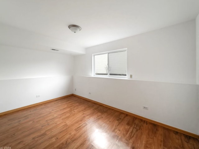 empty room with wood-type flooring