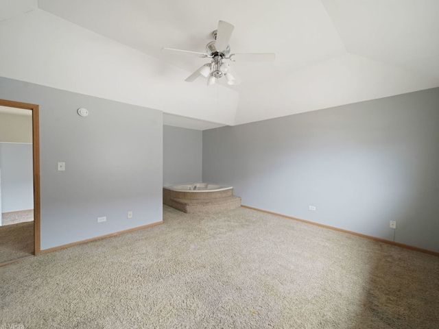 interior space with lofted ceiling, carpet floors, and ceiling fan