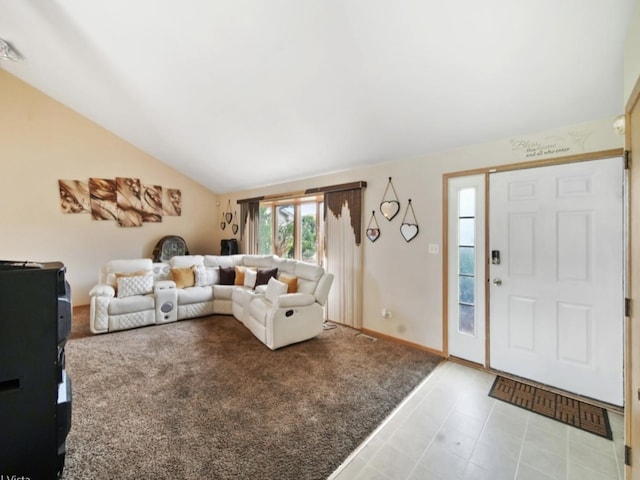 living room featuring vaulted ceiling