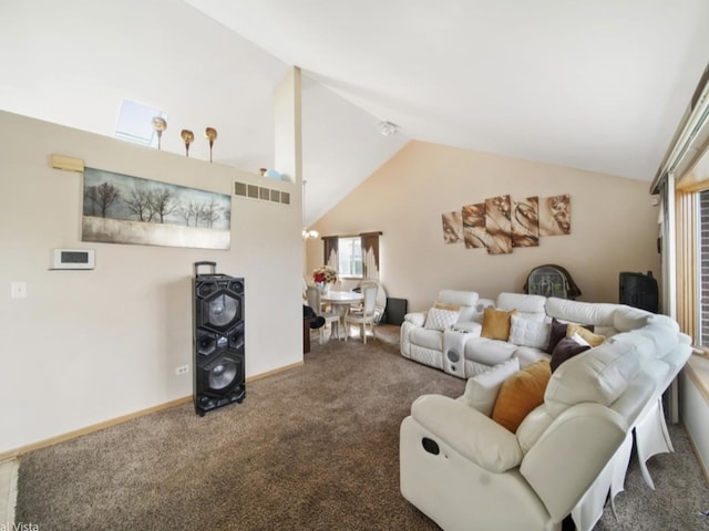 carpeted living room with vaulted ceiling