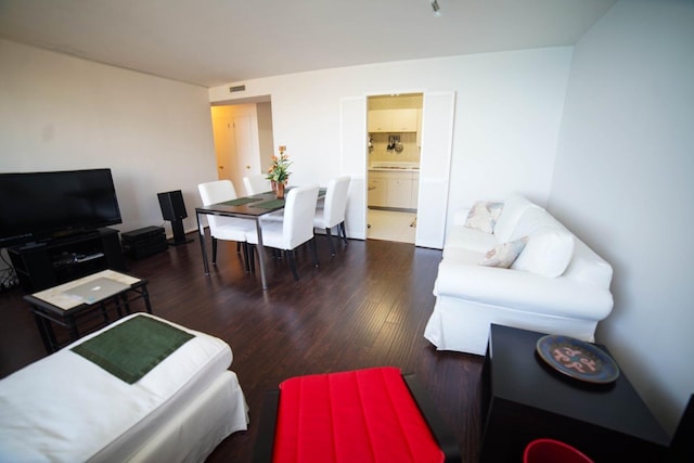 living room featuring dark hardwood / wood-style floors