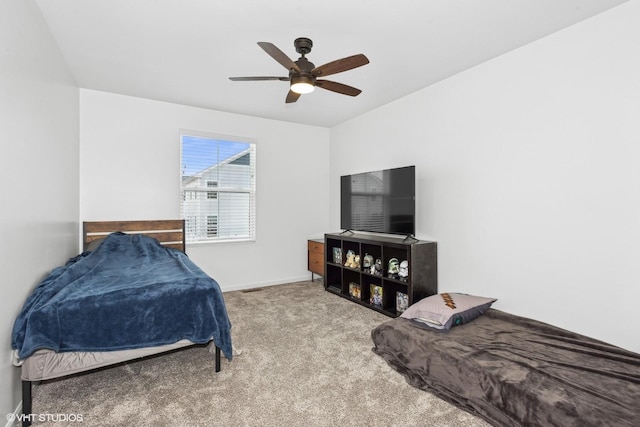 bedroom with light carpet and ceiling fan