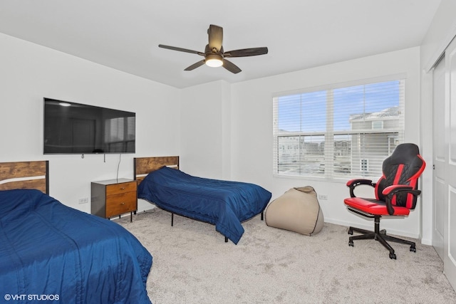 carpeted bedroom with ceiling fan