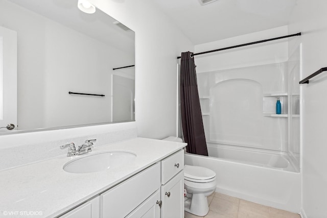 full bathroom with tile patterned flooring, vanity, toilet, and shower / bath combo with shower curtain