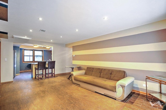 living room with wood-type flooring and bar area