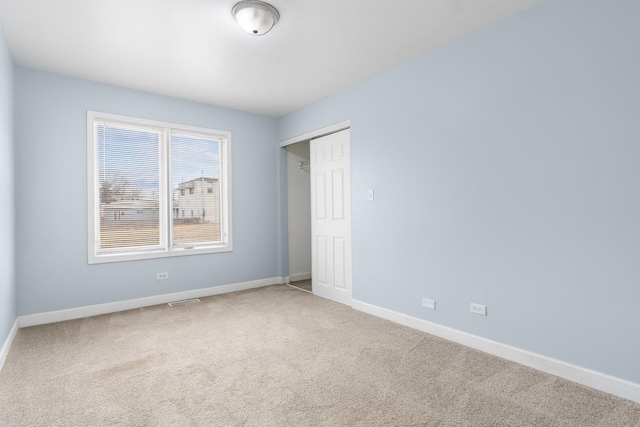 unfurnished room featuring carpet