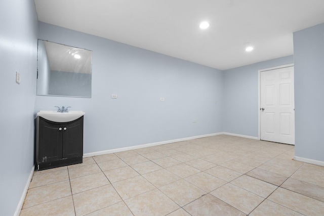 tiled spare room with sink