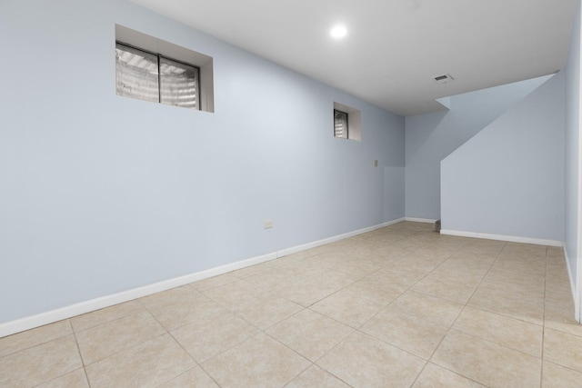 basement with light tile patterned flooring