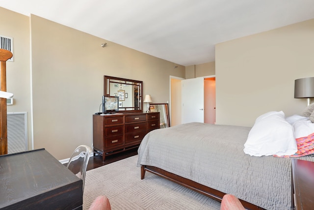 bedroom with hardwood / wood-style floors