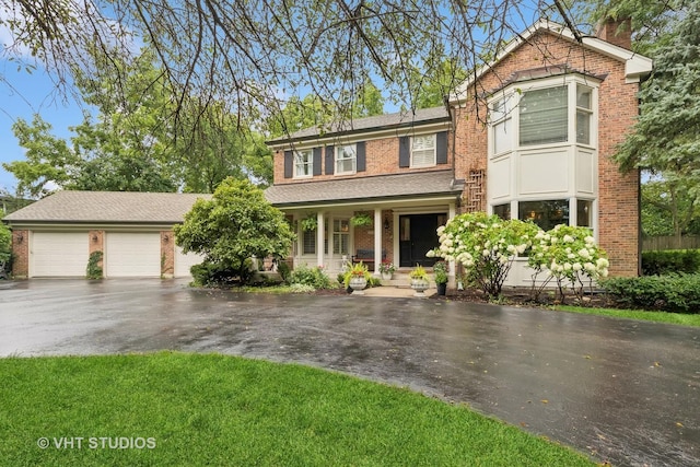 view of front of home featuring a porch and a garage