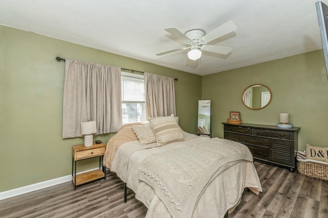 bedroom with ceiling fan and dark hardwood / wood-style flooring