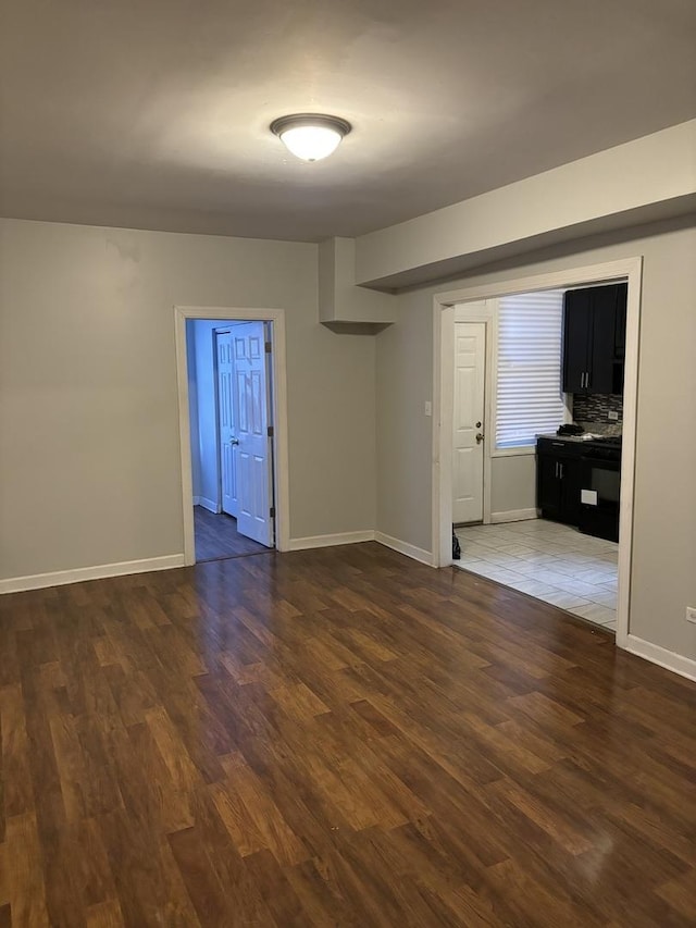 empty room featuring dark hardwood / wood-style flooring