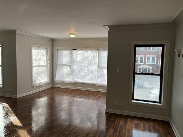 unfurnished room featuring crown molding and dark hardwood / wood-style flooring