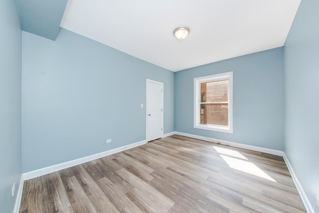 unfurnished room featuring light hardwood / wood-style flooring