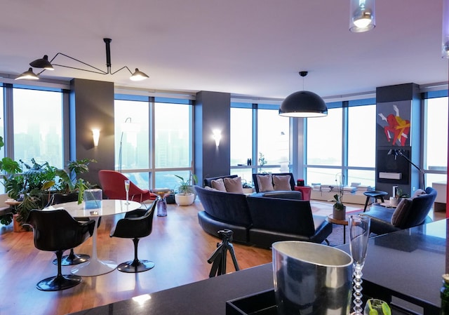 living room featuring hardwood / wood-style floors and a wall of windows