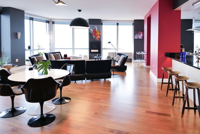 dining area featuring a healthy amount of sunlight and light wood-type flooring