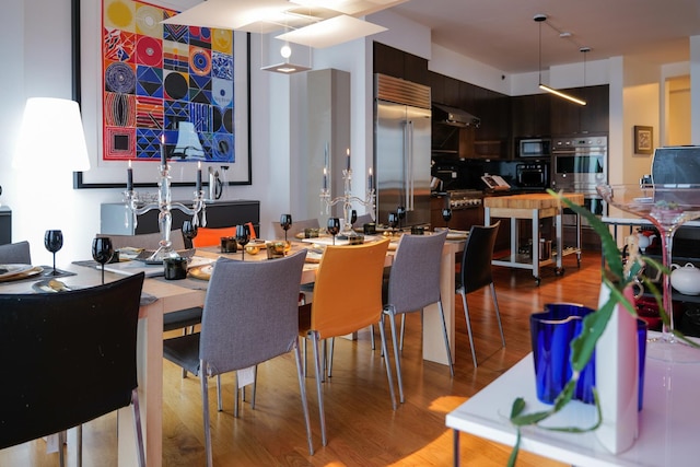 dining space featuring light hardwood / wood-style floors