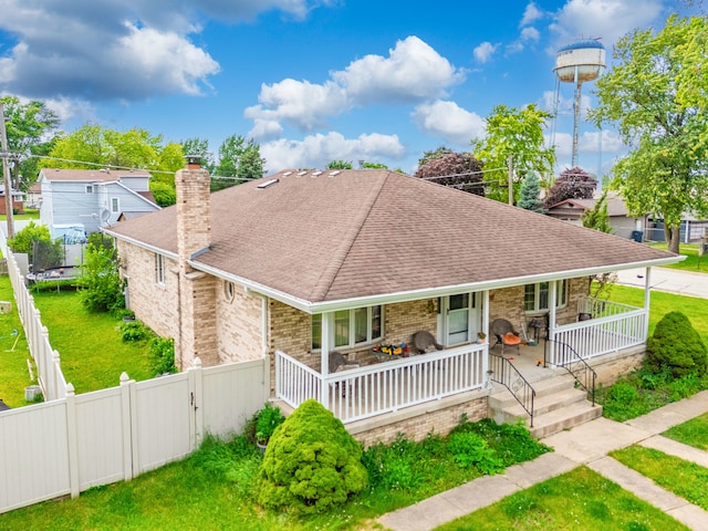 view of front of home with covered porch and a trampoline