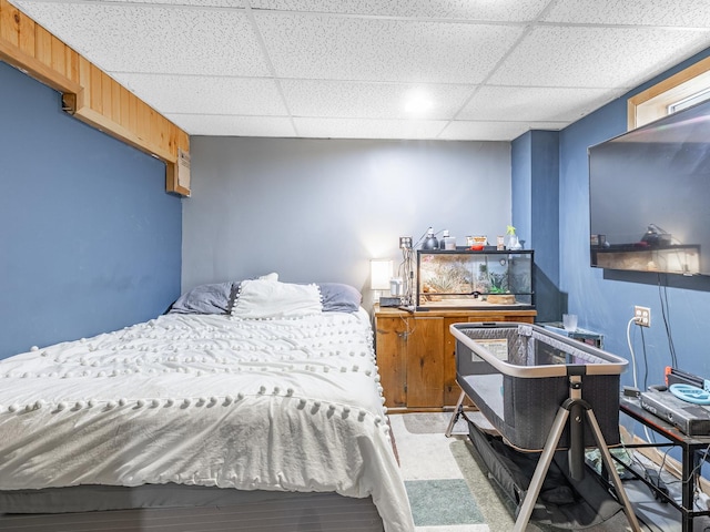 bedroom with a paneled ceiling