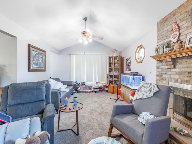 carpeted living room with ceiling fan, a fireplace, and vaulted ceiling